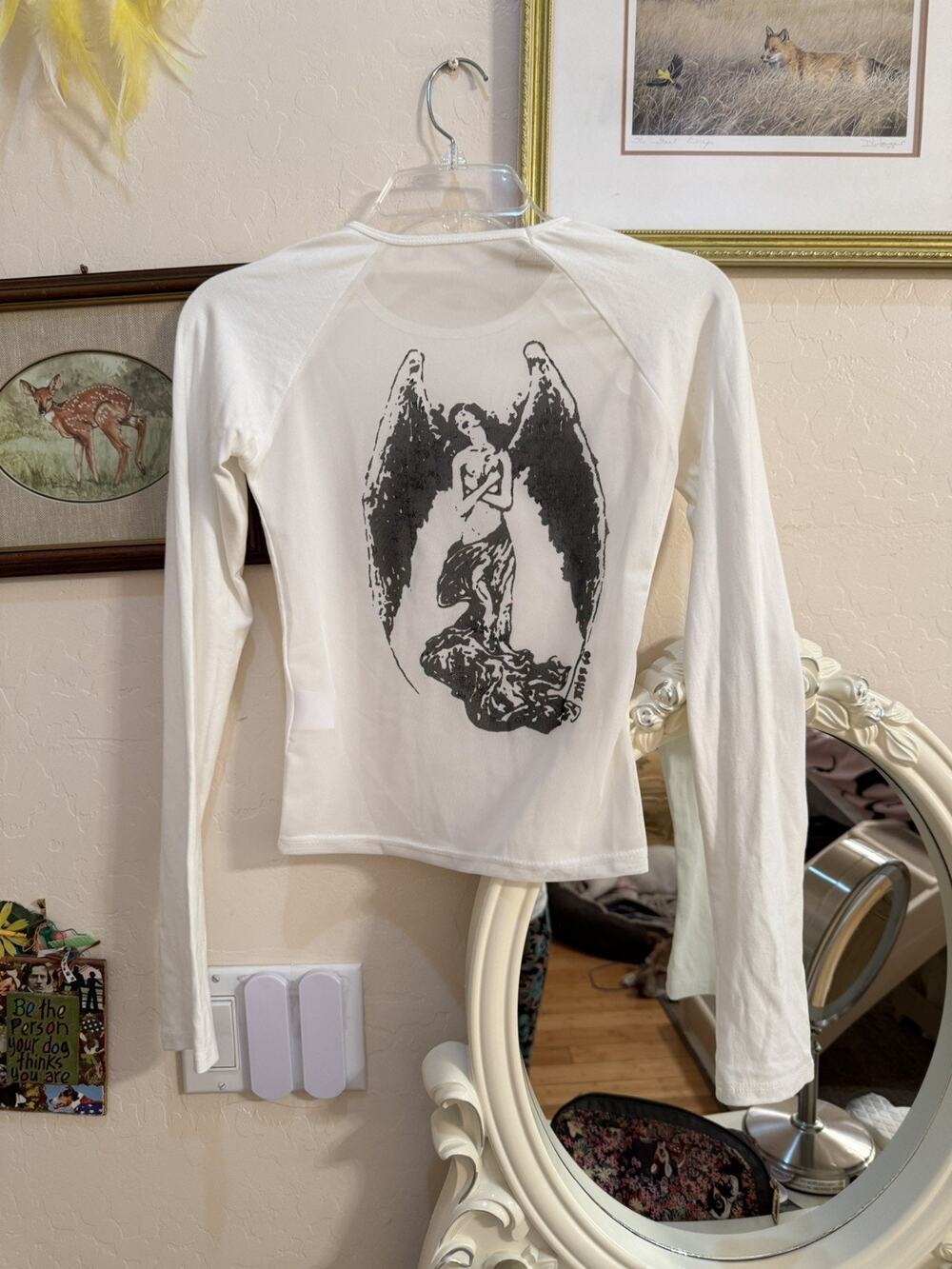 White long sleeve top with fallen angel graphic on the mesh back. Sz S.
